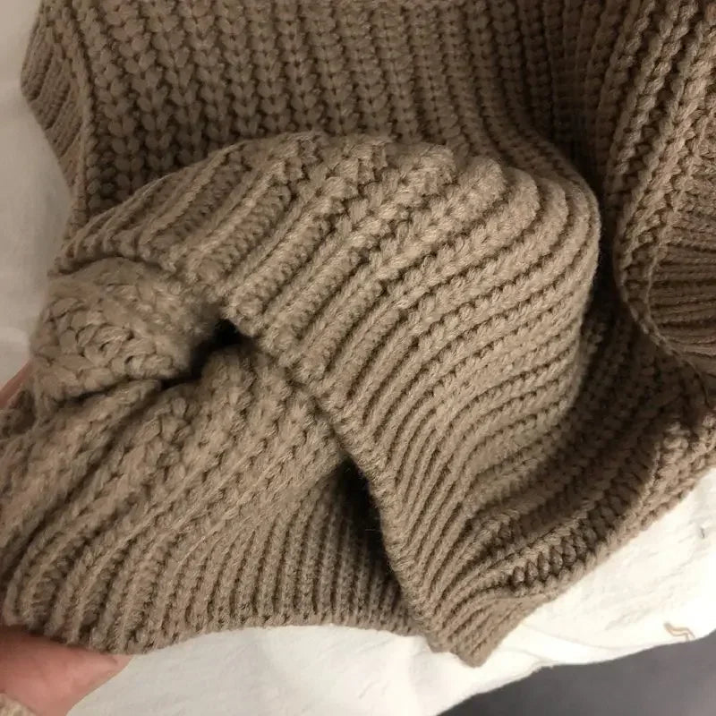 Close-up of the brown sweater vest&