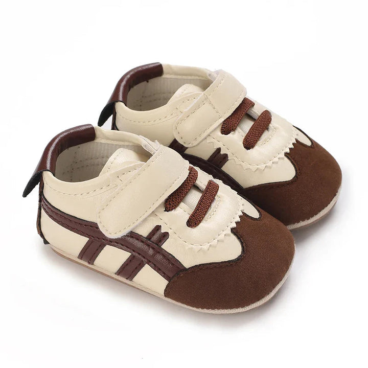 Brown and cream baby sneakers with contrast side stripes and fastening straps