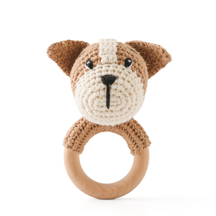 Brown and cream crocheted dog rattle with a wooden ring