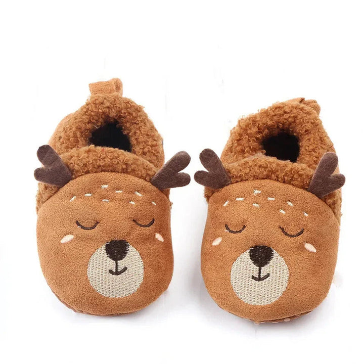 Brown deer baby slippers with antlers, sleepy faces, and fuzzy openings.