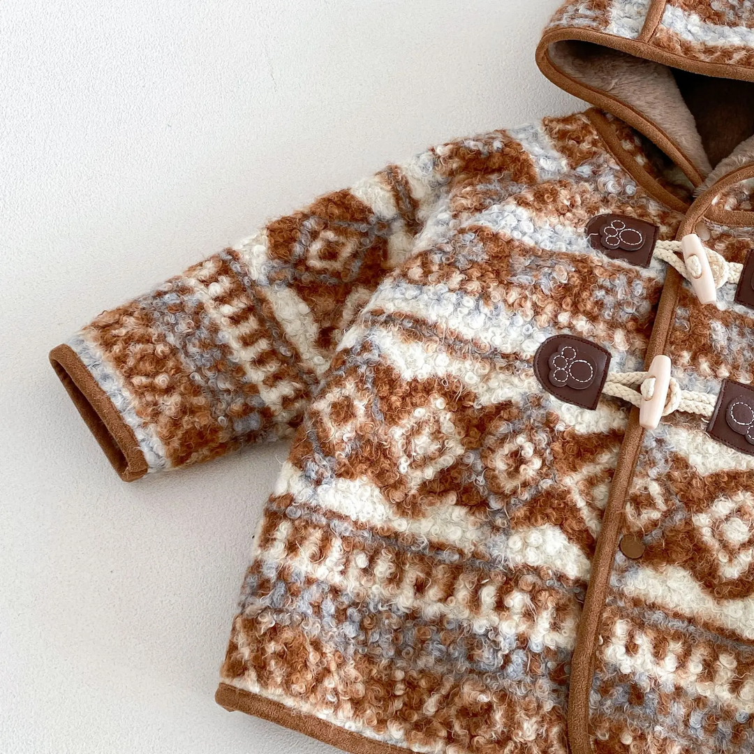 Brown patterned jacket sleeve with rolled cuff and contrasting edge trim