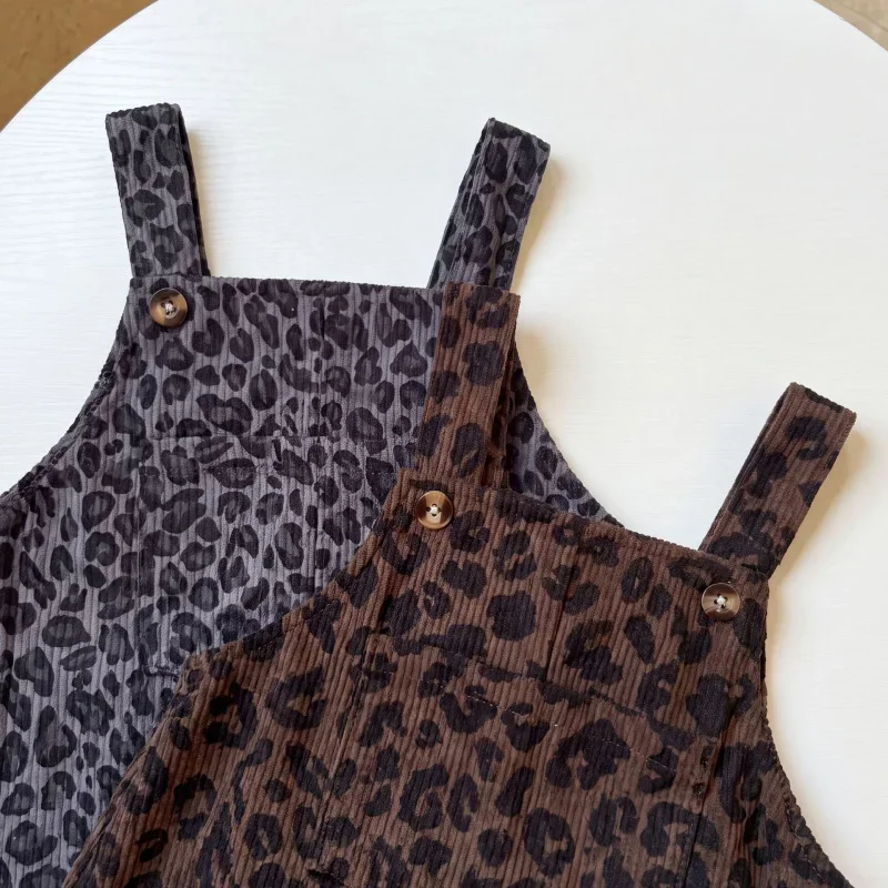 Overlapping brown and gray leopard print overalls showing bibs and shoulder buttons