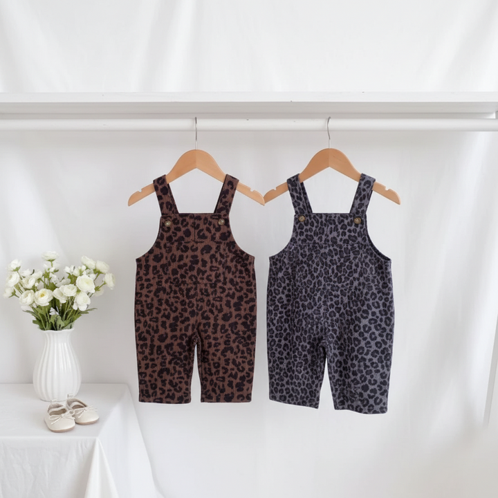 Brown and gray leopard print overalls hanging side by side on a clothing rail