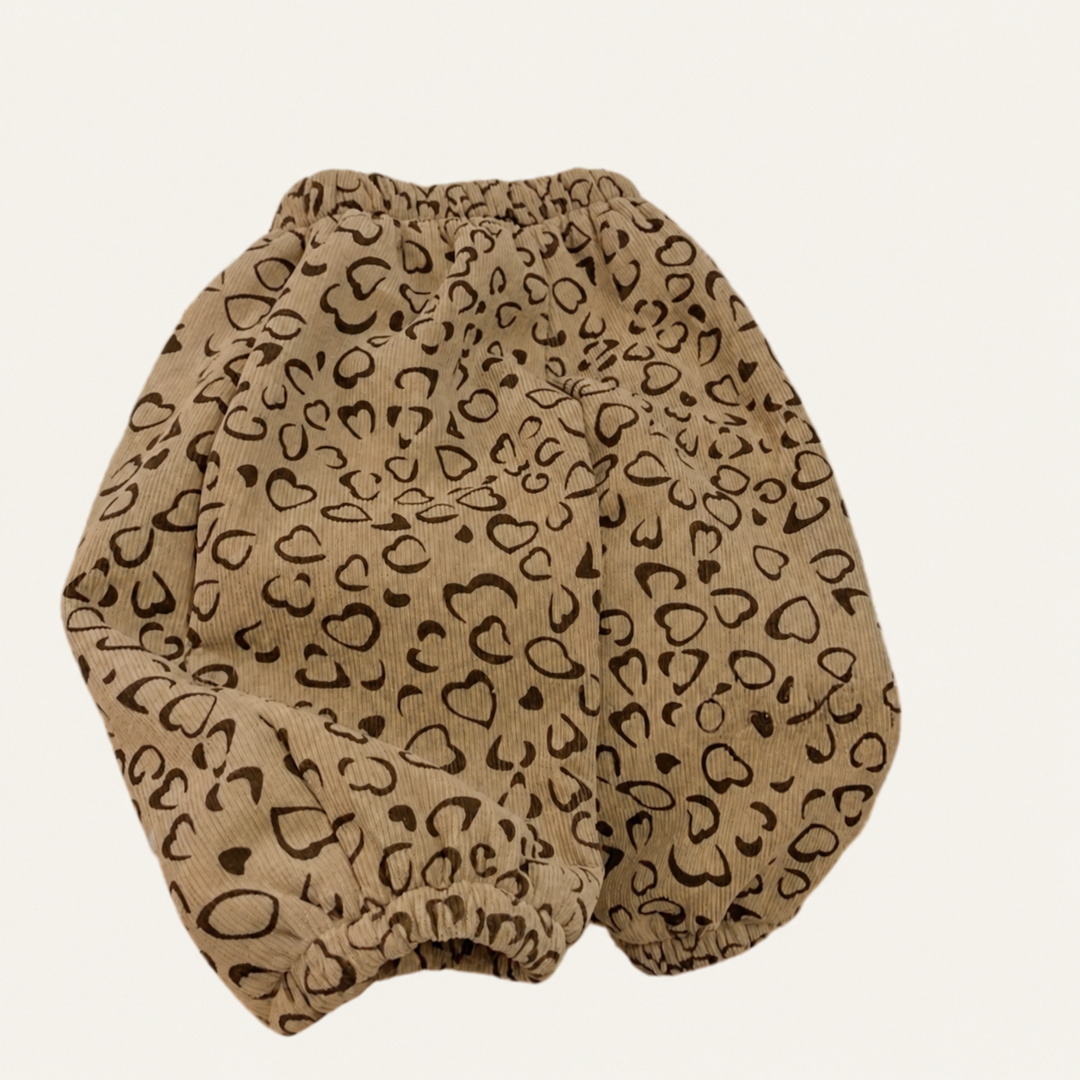 Brown heart pants with a roomy leg shape and gathered cuffs