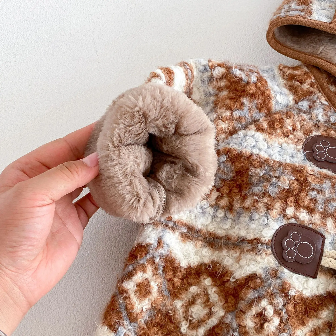 Close-up of the soft lining inside a brown jacket cuff