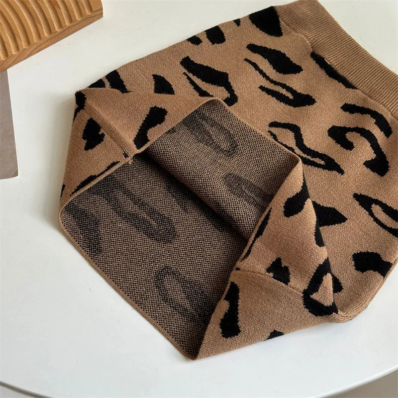 Brown leopard-pattern knit skirt folded to show the reverse side of the fabric.