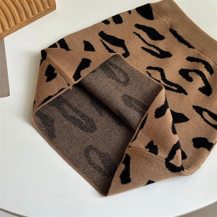 Brown leopard-pattern knit skirt folded to show the reverse side of the fabric.