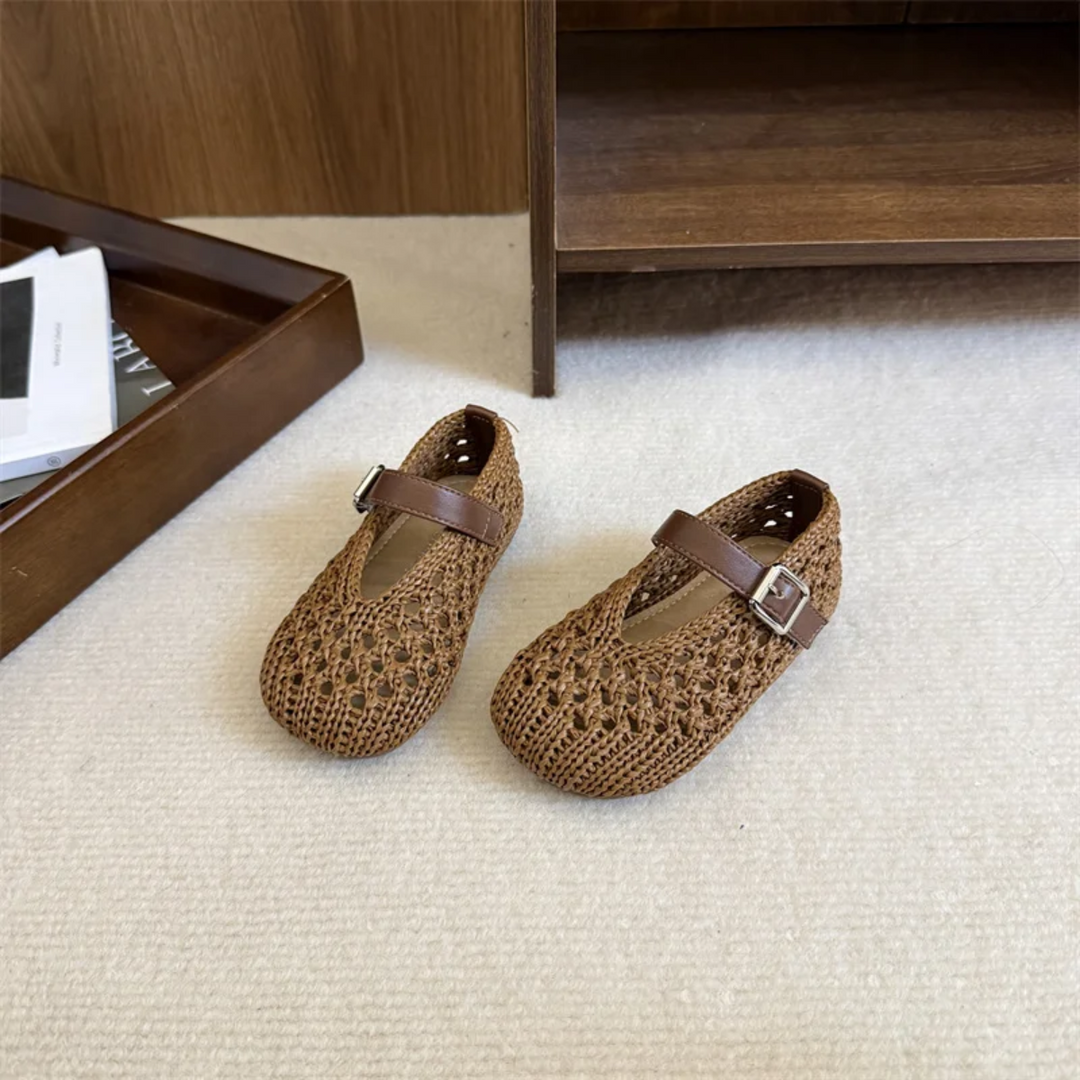 Brown Mary Jane flats with openwork uppers and buckle-detail straps
