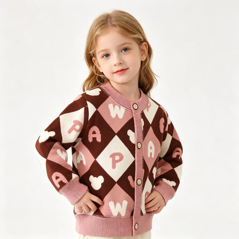Child wearing a brown and pink diamond-pattern cardigan with a round neck and button front