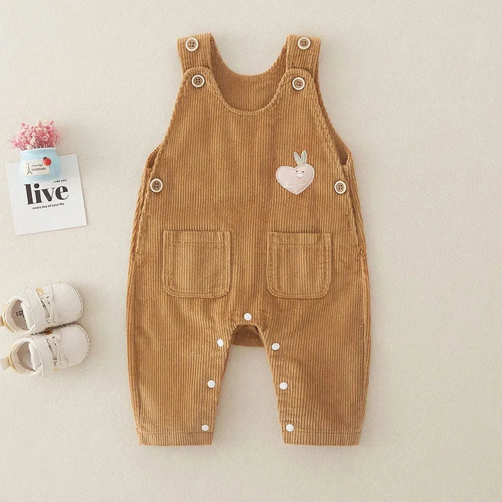 Brown ribbed baby overalls with front pockets, shoulder buttons, and leg snaps