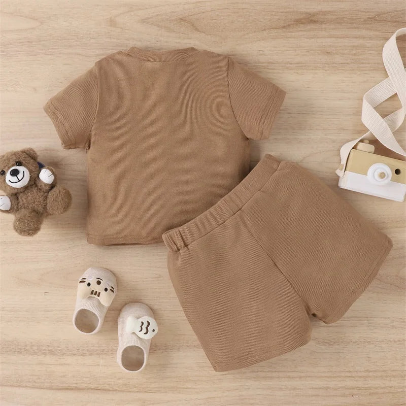 Back view of the brown ribbed T-shirt with matching elastic-waist shorts