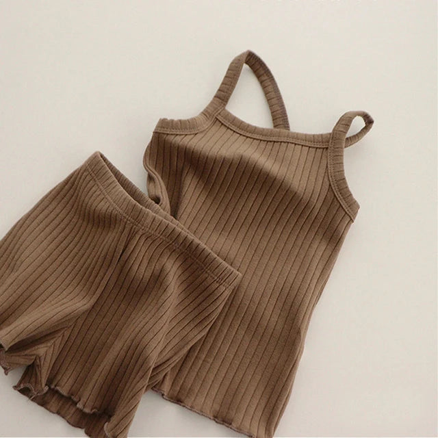 Brown ribbed pajama tank and matching elastic-waist shorts laid flat