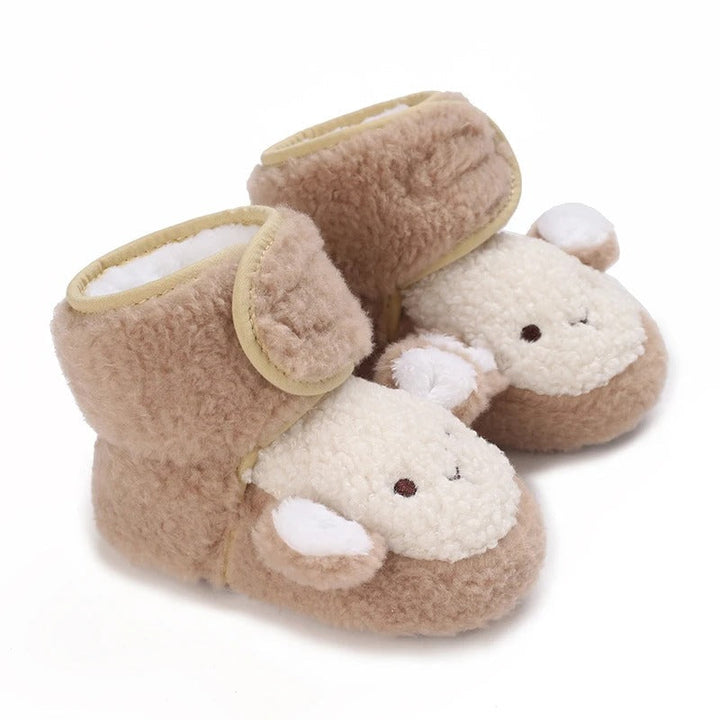 Brown baby shoes with cream sheep faces and plush ankle straps.