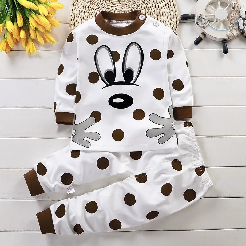 White pajama top and pants with brown spots, brown trim and a large cartoon face