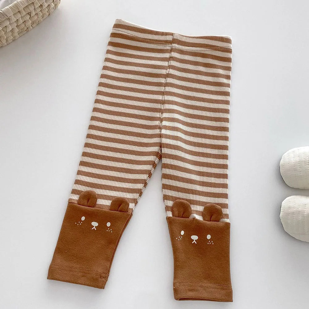 Brown-and-cream striped leggings with brown animal-face cuffs and rounded ears
