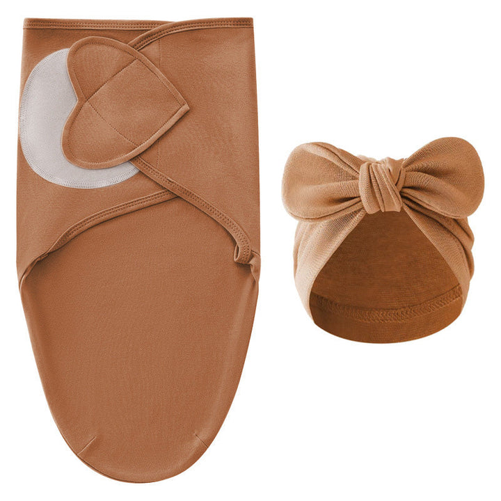 Brown swaddle blanket with adjustable fastening and a matching bow hat