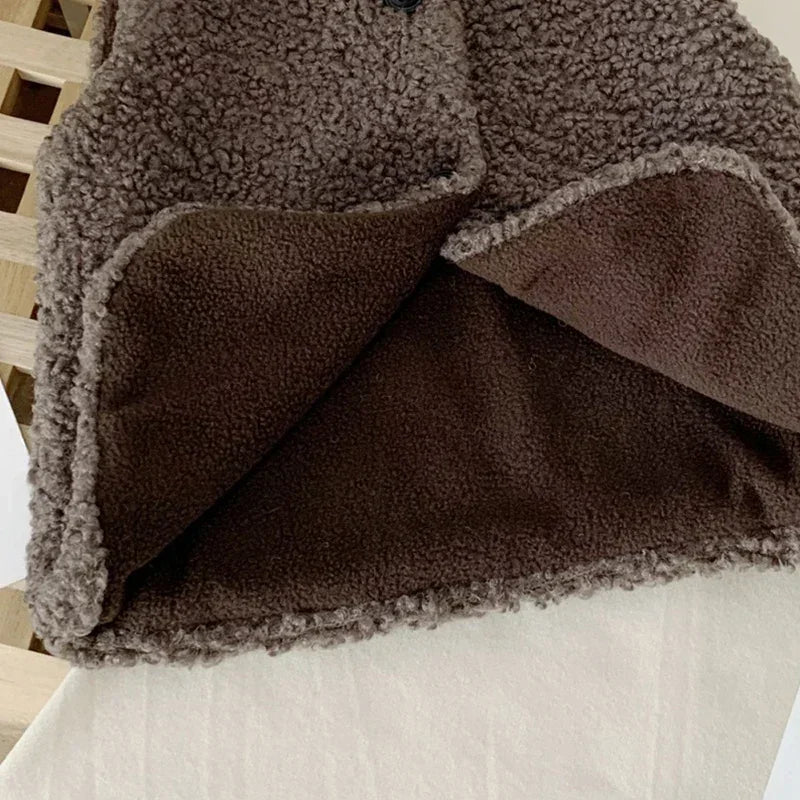 Close-up of the brown vest&