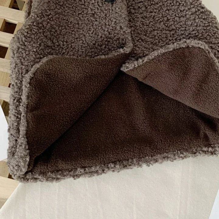 Close-up of the brown vest&