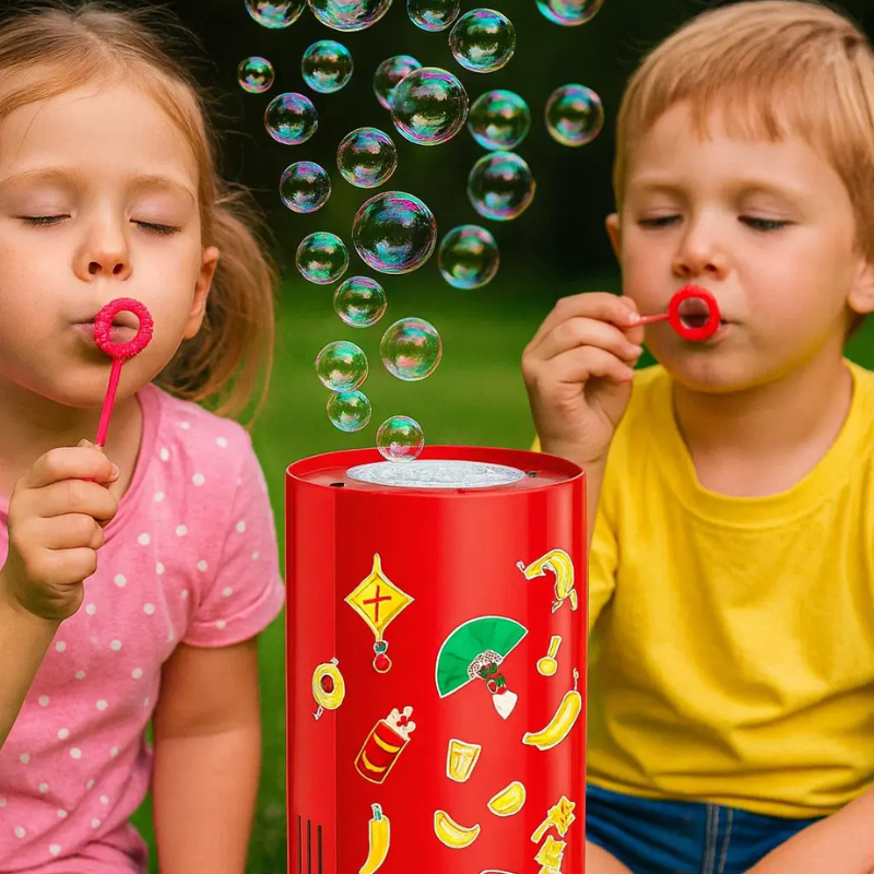 Two children holding bubble wands beside a red bubble machine outdoors