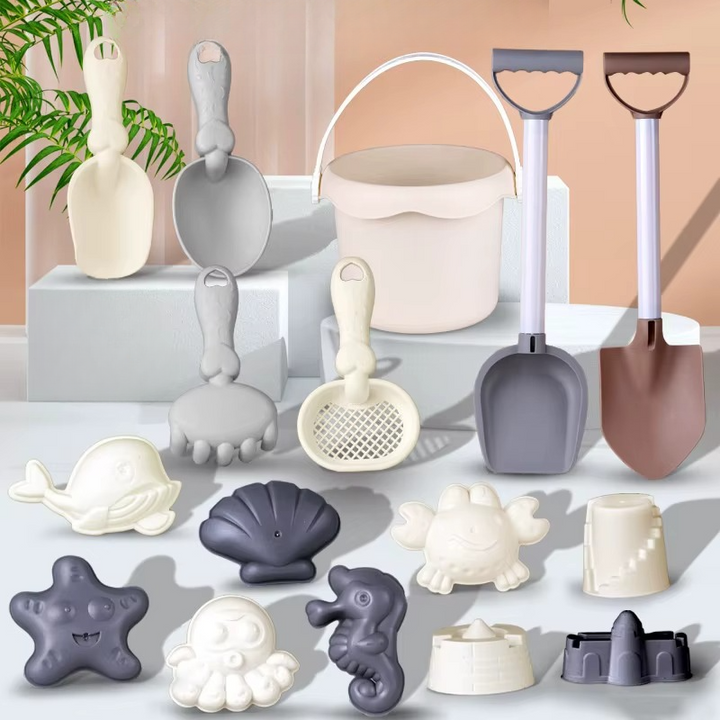 Beach bucket and long shovels with a rake, sieve, scoops, and sea-creature molds