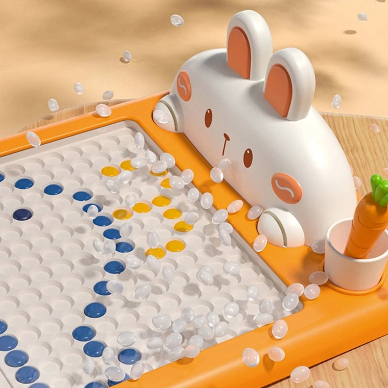 Bunny topper and colorful bead grid with a carrot-shaped pen in the board&