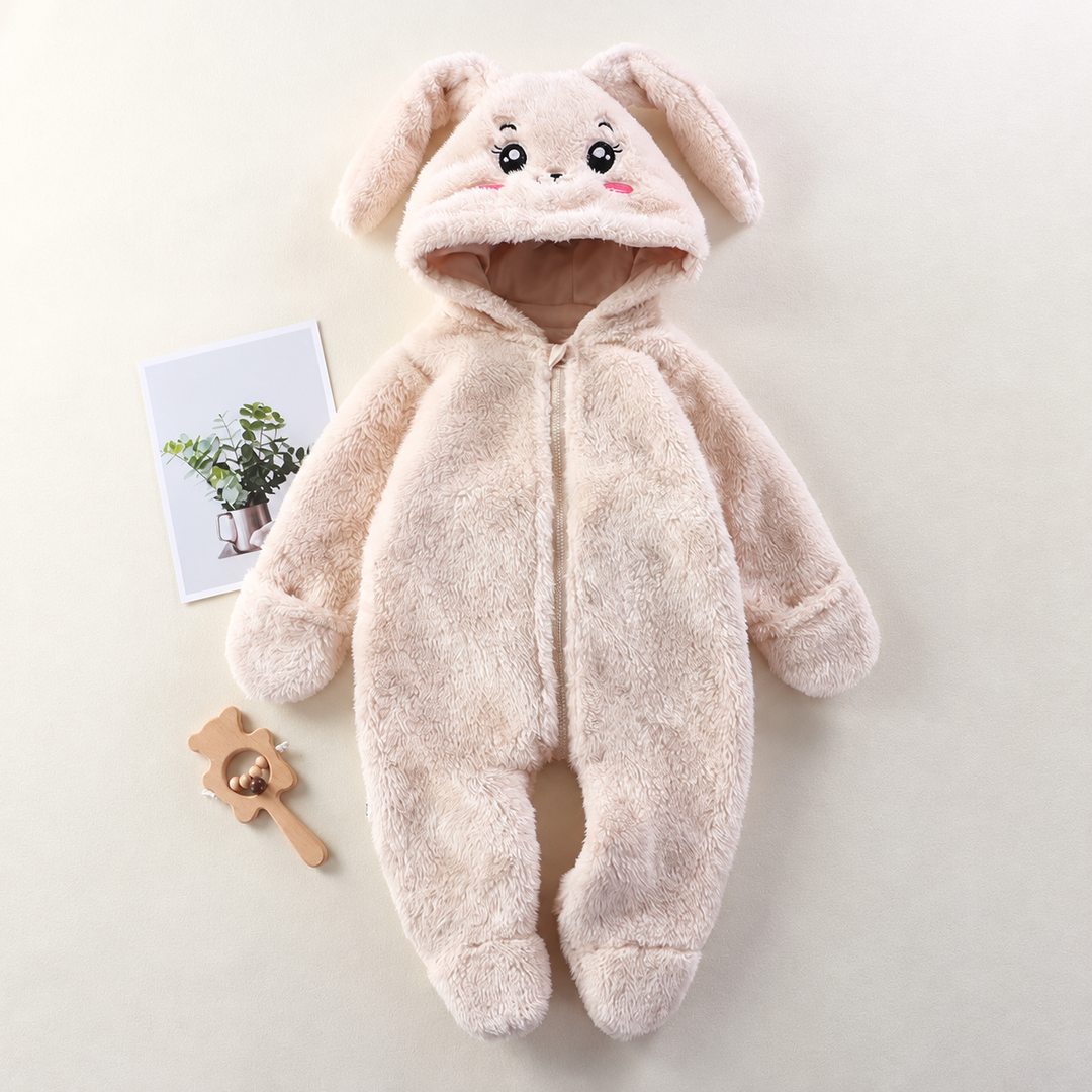 Light-colored bunny baby onesie with floppy hood ears, a front zipper, and covered feet.