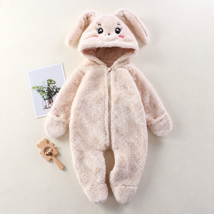 Light-colored bunny baby onesie with floppy hood ears, a front zipper, and covered feet.