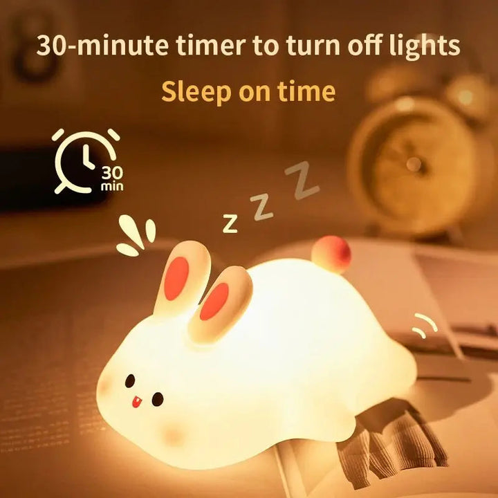 Bunny night light beside a clock with a 30-minute shutoff timer graphic