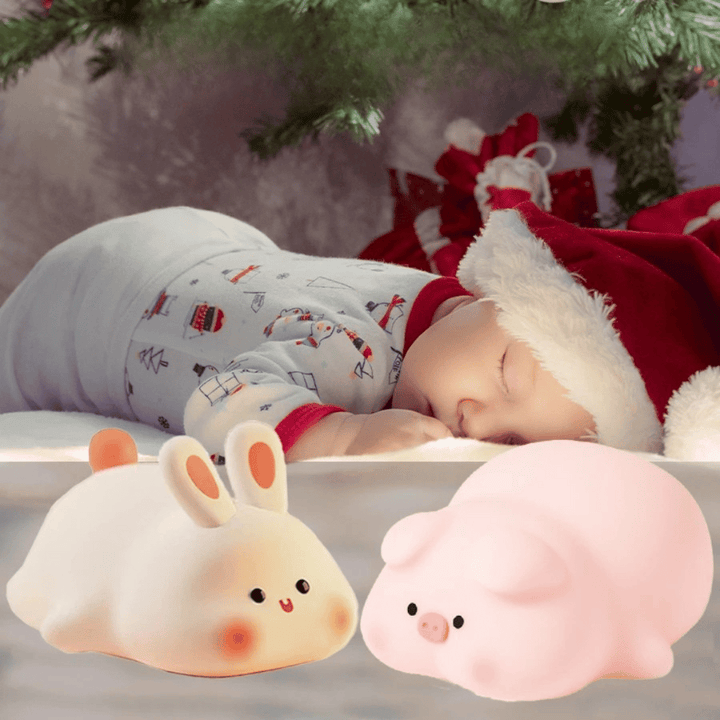 Bunny and pig night lights beside a sleeping child