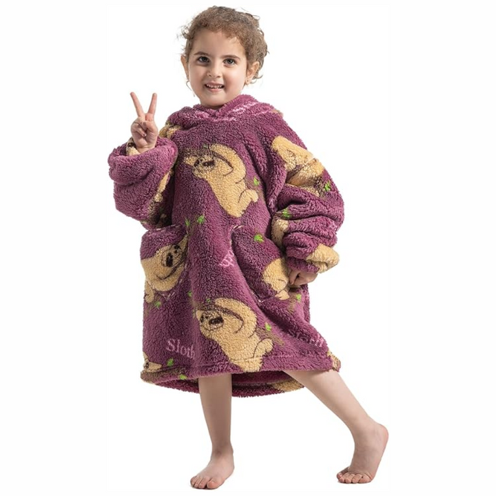 Child wearing a burgundy sloth-print hooded blanket with a roomy fit
