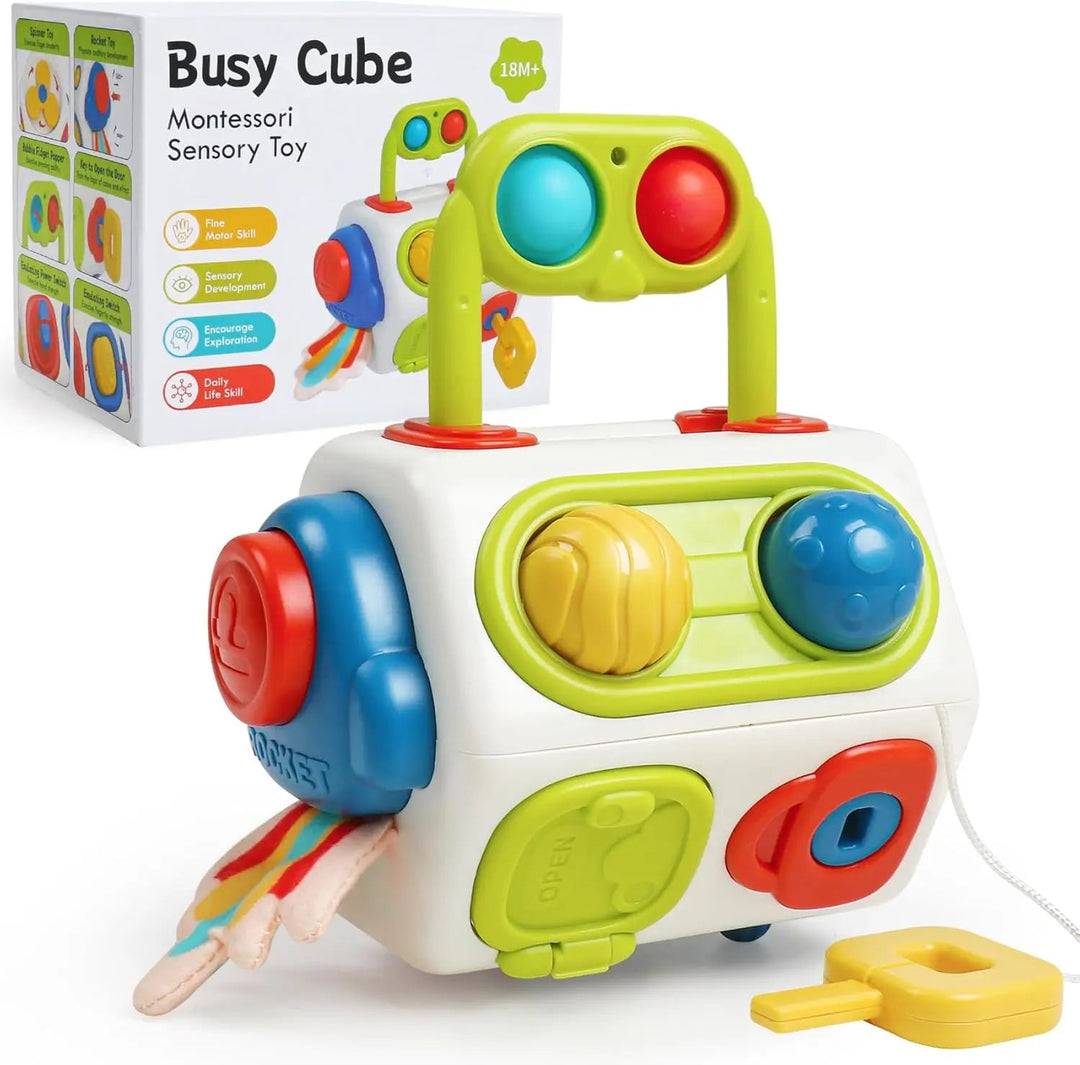Multicolored activity cube with carry handle, push buttons, tethered yellow key, and retail box