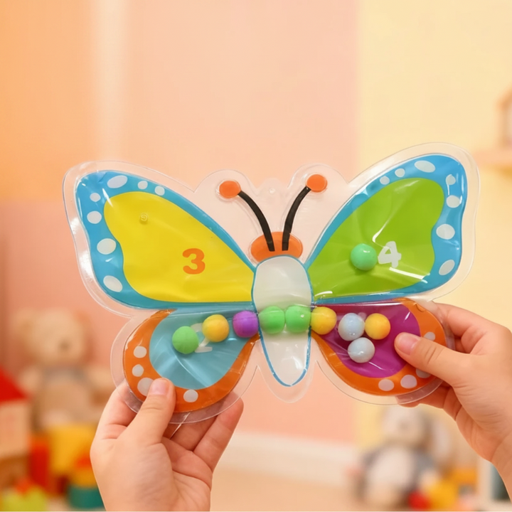 Butterfly-shaped bead maze with four colored wings and movable beads