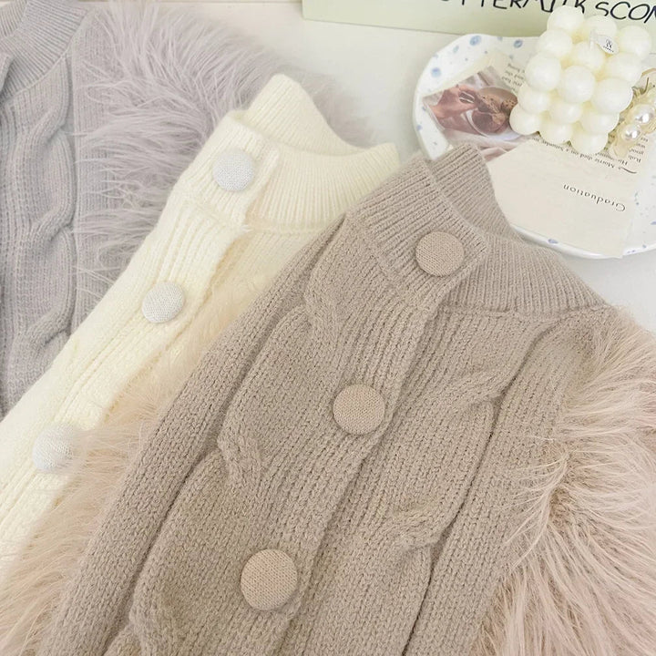 Close-up of round buttons and cable-knit detailing on beige, white and gray coats.