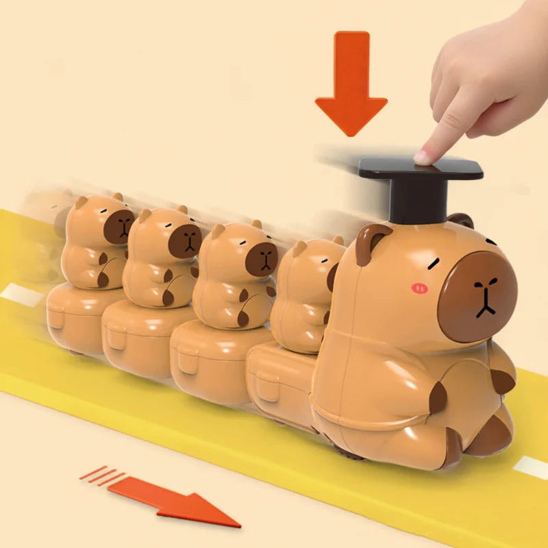 Finger pressing a brown capybara train&