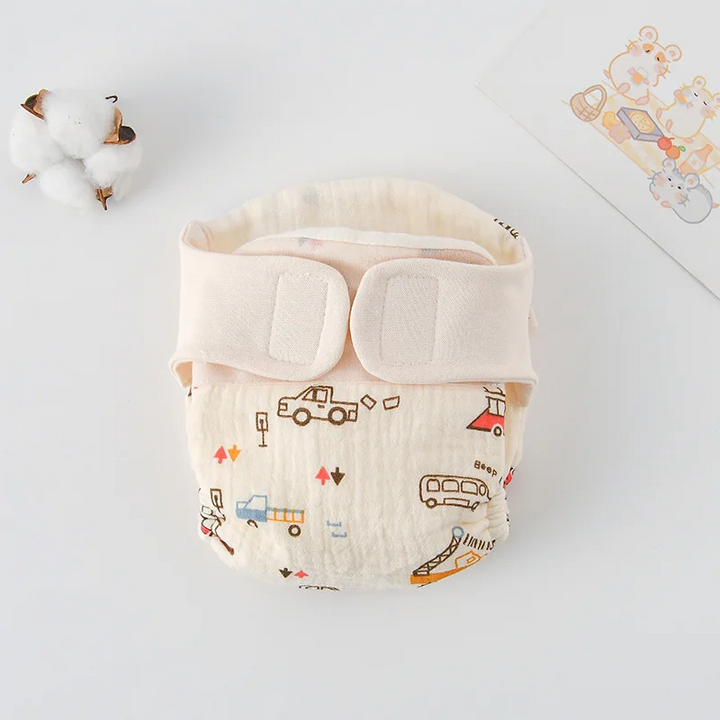 Vehicle-print cloth diaper with cars, buses, and a cream hook-and-loop waistband