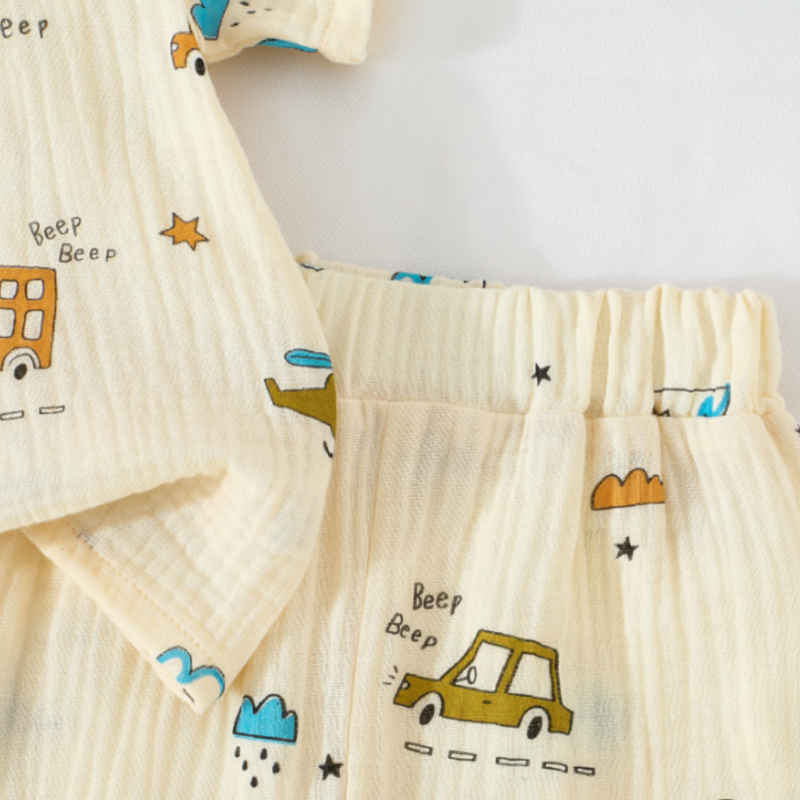 Close-up of car-print cotton fabric and the elastic waistband on the matching shorts