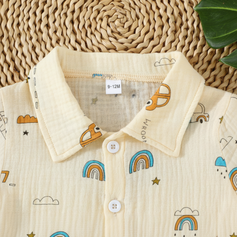 Close-up of the collar and front buttons on the cream car-print shirt