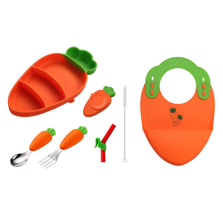 Carrot-themed plate, bib, fork, spoon, straw, and cleaning brush arranged on white