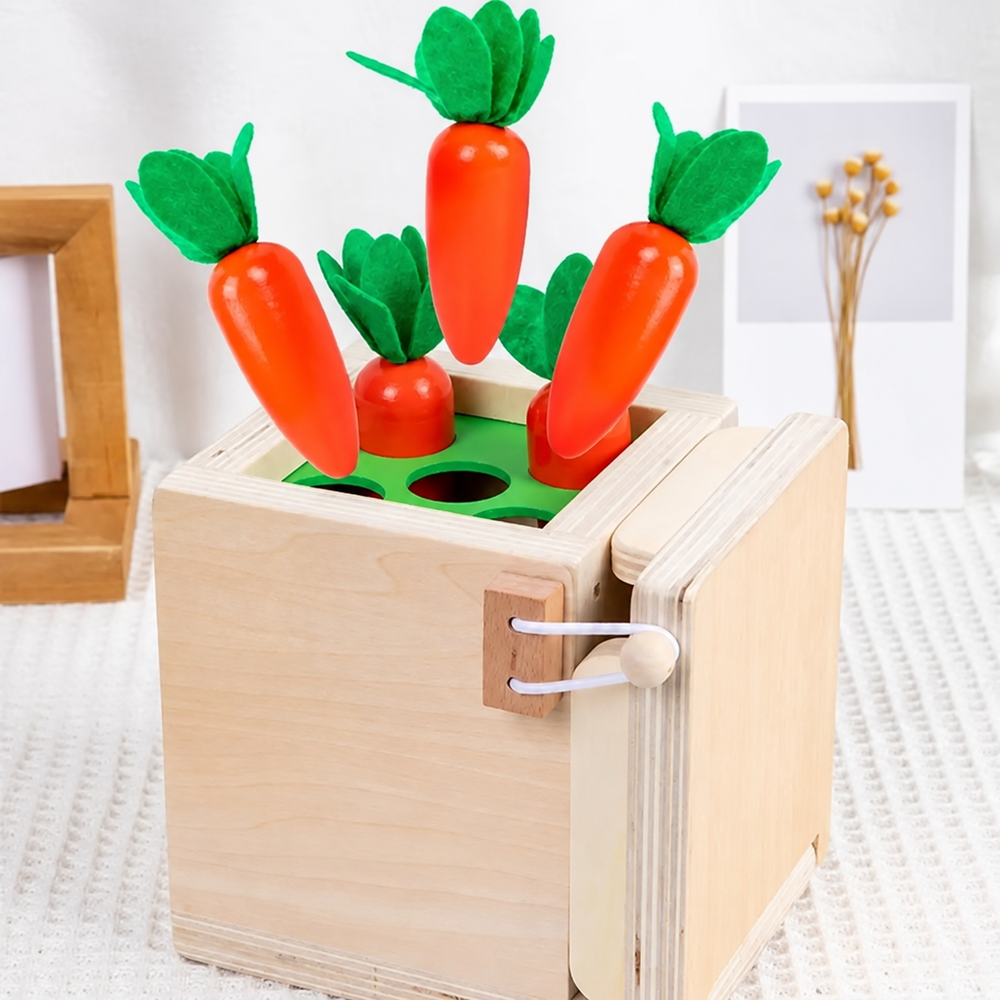 Orange carrots in a green garden sorting panel on a wooden activity box