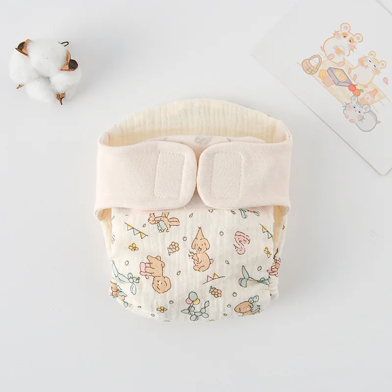 Cloth diaper with cartoon dogs and small colorful motifs