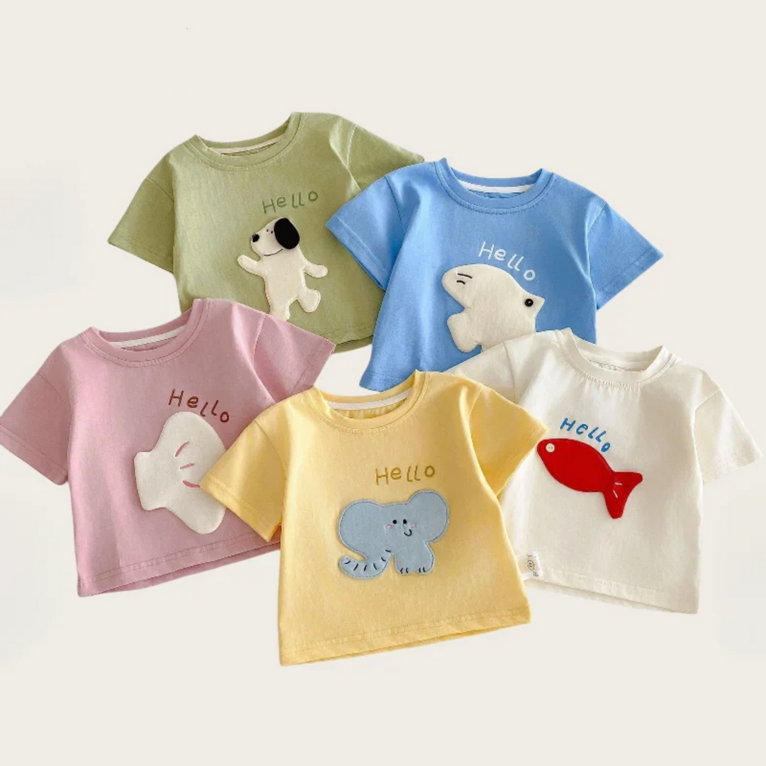 Five short-sleeve cartoon patch T-shirts in pink, yellow, blue, green, and beige