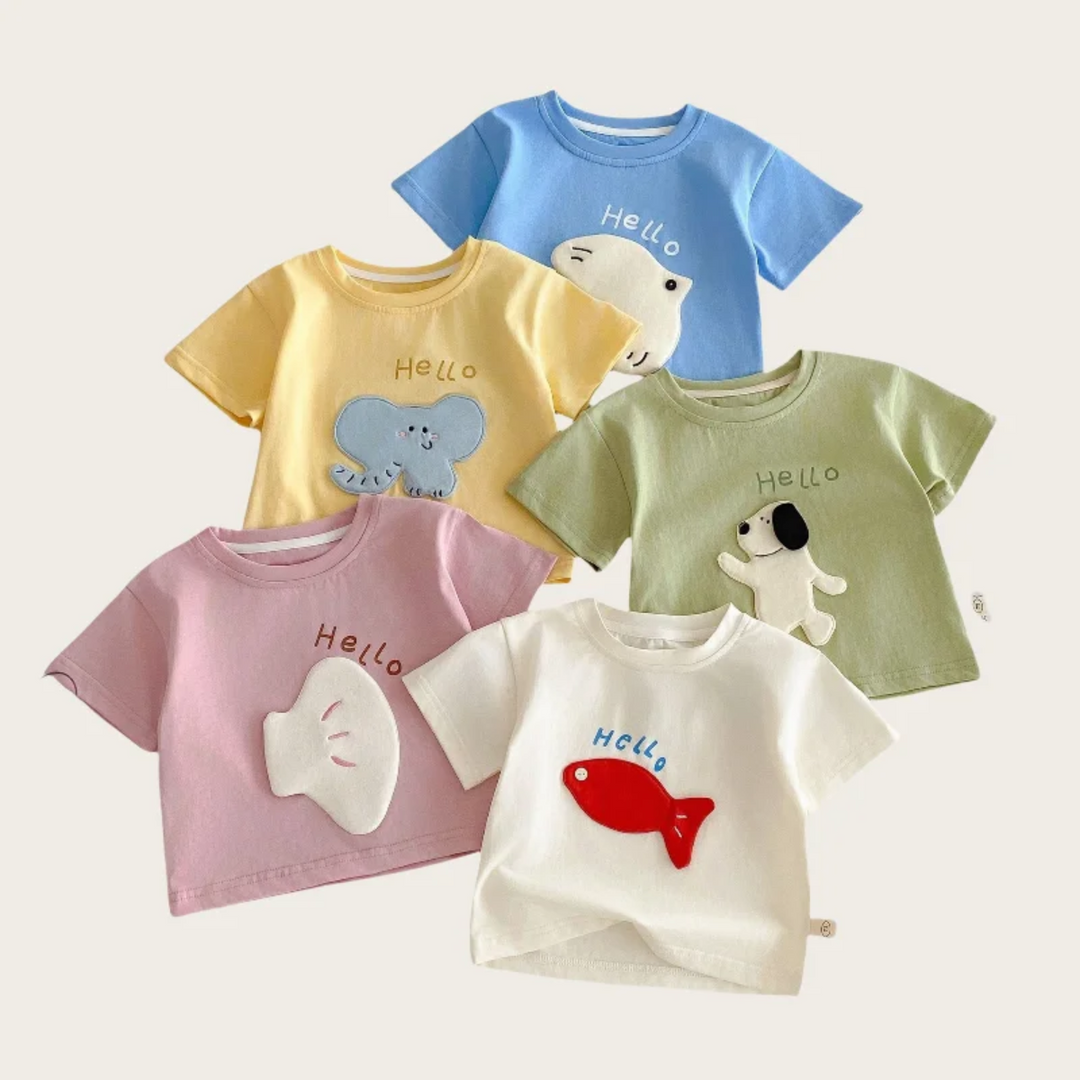 Flat lay of five short-sleeve T-shirts with animal and character patches