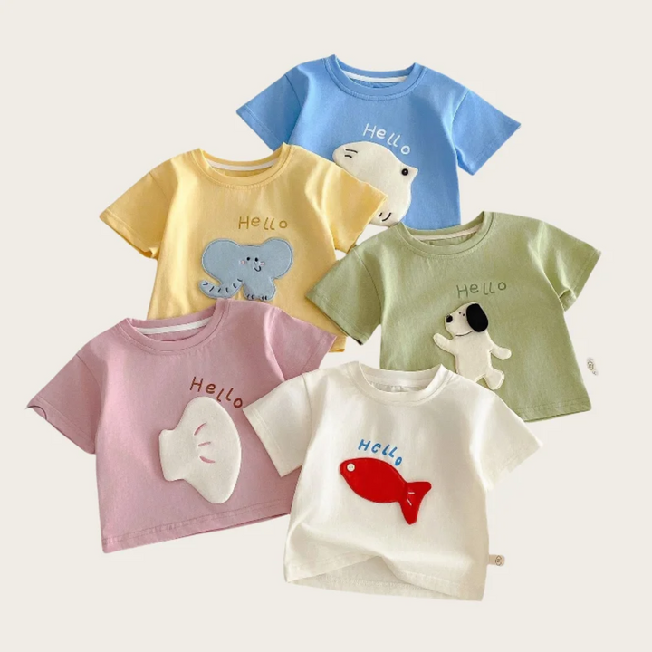 Flat lay of five short-sleeve T-shirts with animal and character patches
