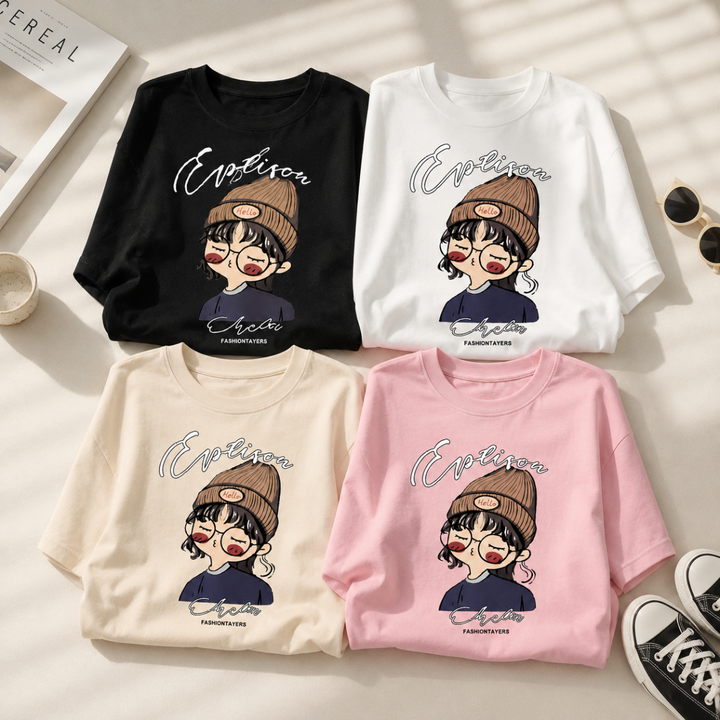 Black, white, apricot, and pink cartoon-print T-shirts arranged together
