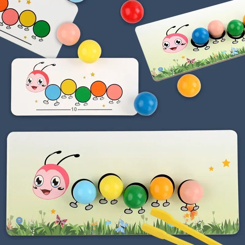 Colorful beads arranged on a caterpillar matching board beside pattern cards and a yellow clip