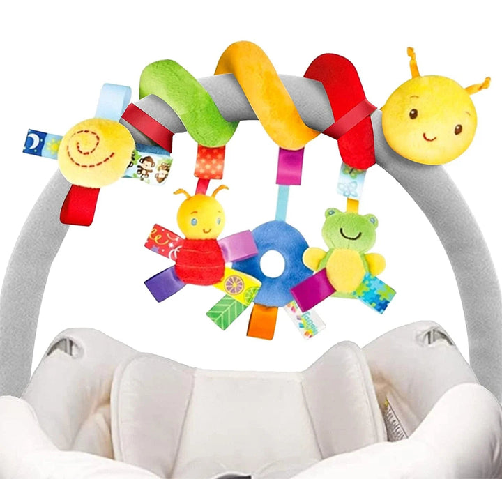 Colorful caterpillar spiral toy wrapped around a gray car seat handle with dangling plush characters