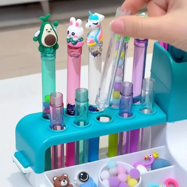 Clear pen barrels and avocado, rabbit, and unicorn toppers in the teal holder