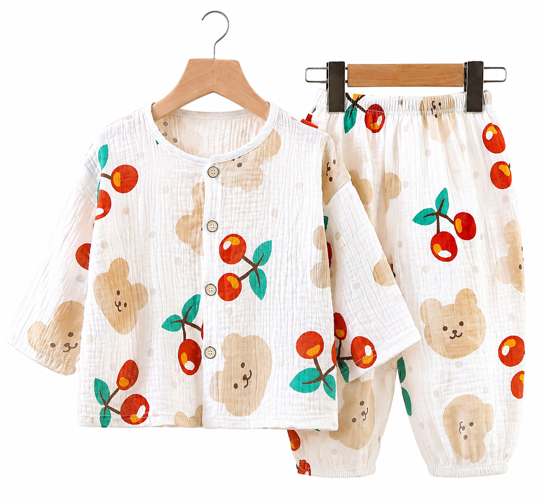 White pajama top and pants with red cherries and tan bear faces