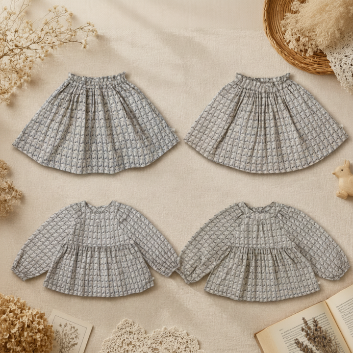 Two printed long-sleeve blouses and two matching elastic-waist skirts arranged on a neutral background