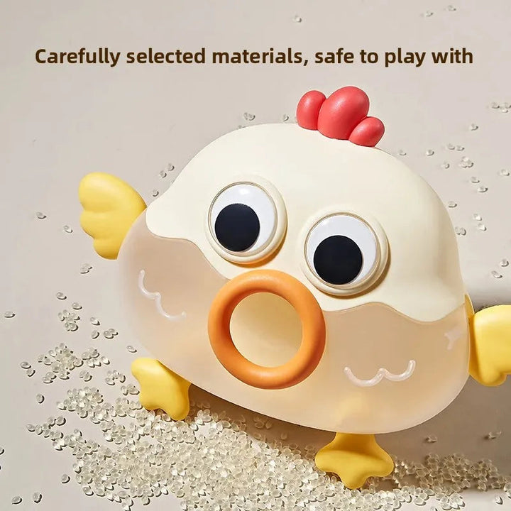 Close-up of the chick ball container with an orange mouth opening and yellow wings
